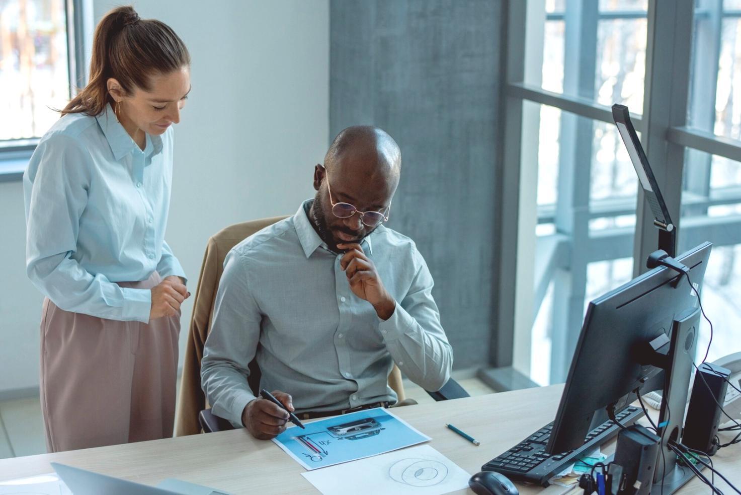 Entrepreneur reviewing financial documents during budgeting session